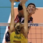 Larson of the US spikes the ball against Mari of Brazil during their women's volleyball match at the FIVB World Grand Prix in Rio de Janeiro