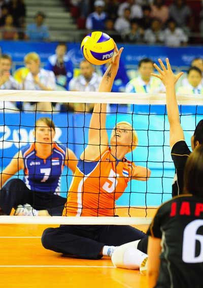 The Netherlands No. 5 Karin van der Haar playing Sitting Volleyball.