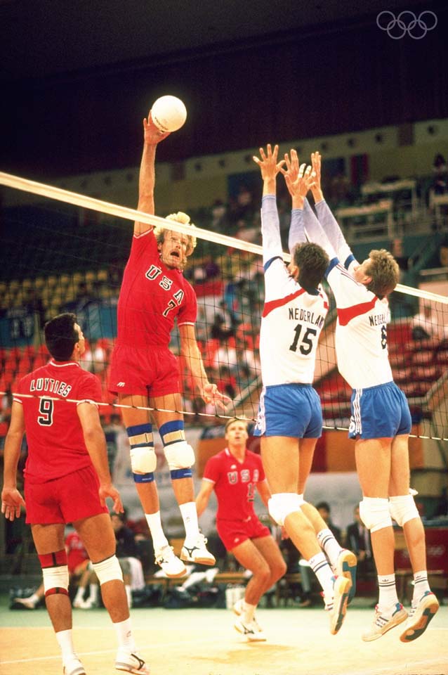 17 Sep-2 Oct 1988:  Craig Buck #7 of the USA spikes the ball while Karl Grabert #15 and J Posthuma #6, both of Holland, try to defend the net during the match in the Volleyball event at the 1988 Olympic Games in Seoul, South Korea. The USA went on to winthe gold medal.  Mandatory Credit: Allsport UK /Allsport